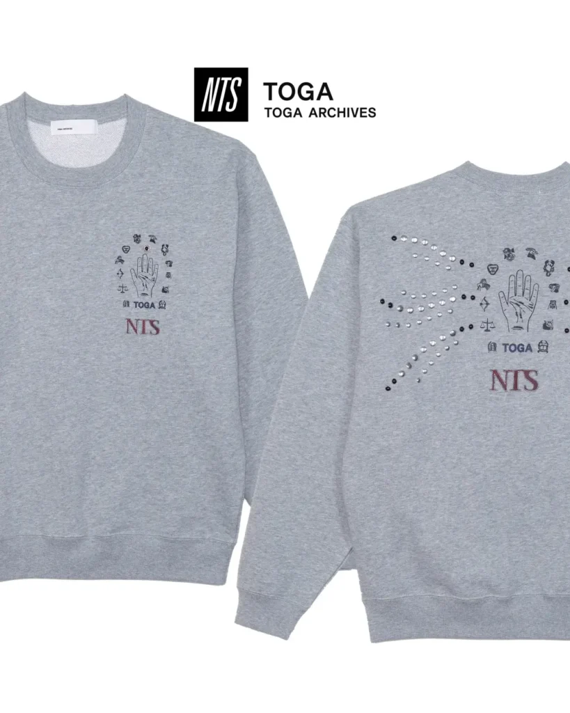 Gray crewneck sweatshirt shown front and back with palmistry graphics, crystal embellishments, and NTS brand