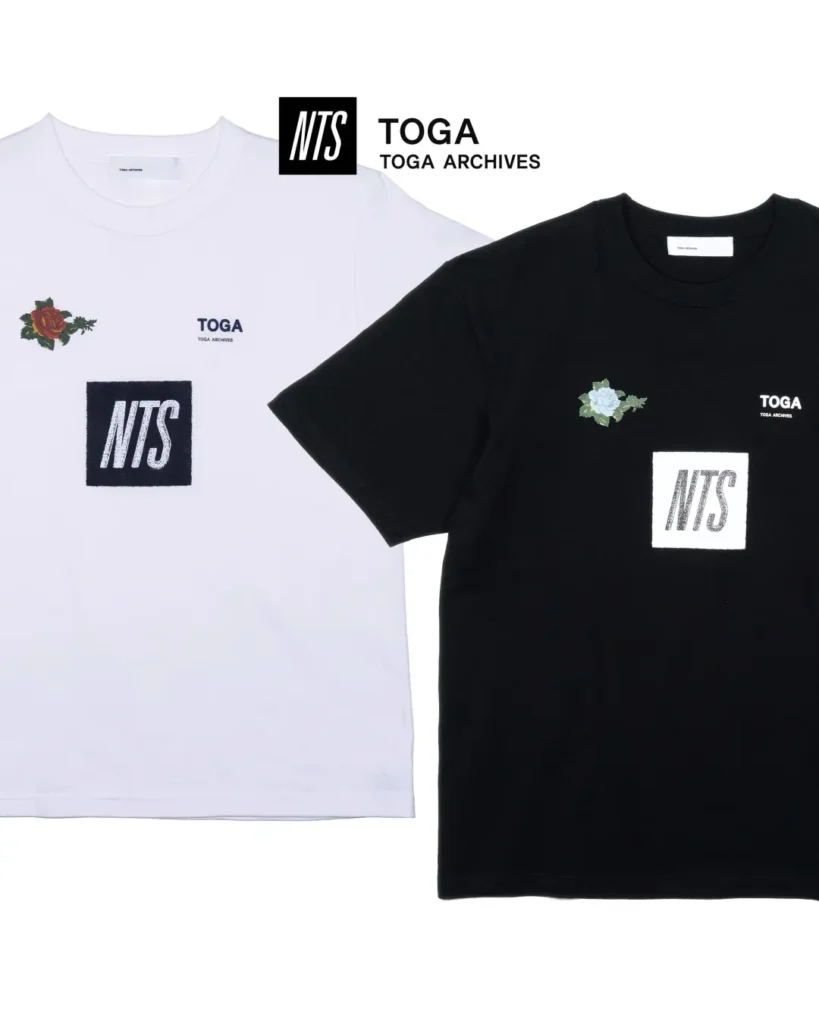 White and black Tee featuring embroidered NTS box logos, floral accents, and TOGA brand on the chest
