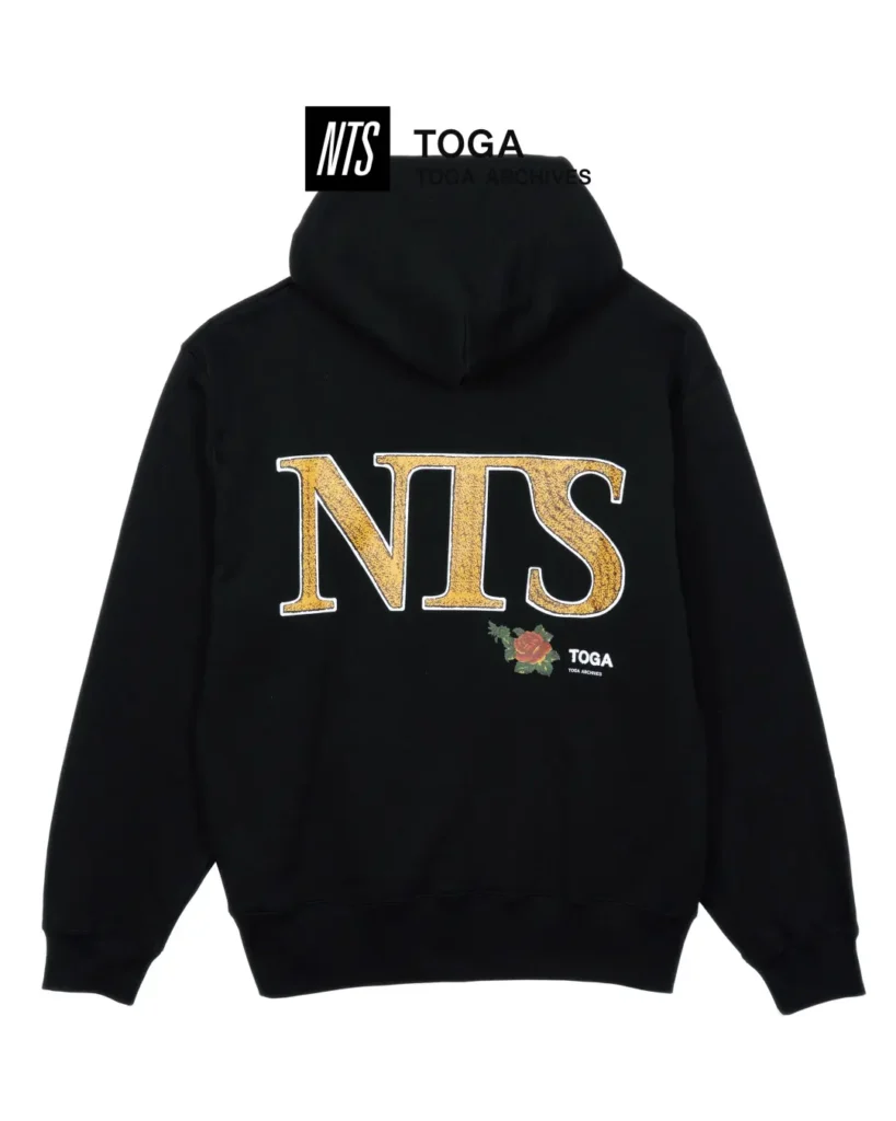 Black hoodie featuring oversized gold NTS lettering, floral graphics, and TOGA brand across the back