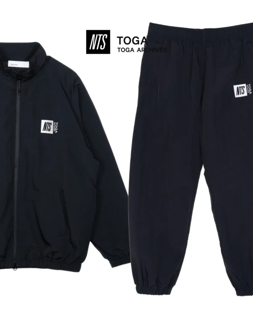 Black zip-up track jacket and matching jogger pants featuring minimalist co-branded NTS and TOGA logo patch
