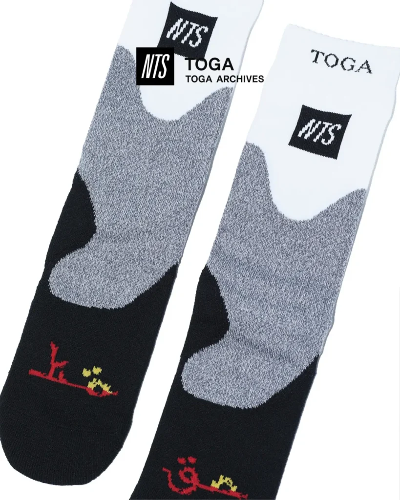 White, gray, and black crew socks featuring NTS logo patches and colorful Japanese-inspired graphic detail near the foot