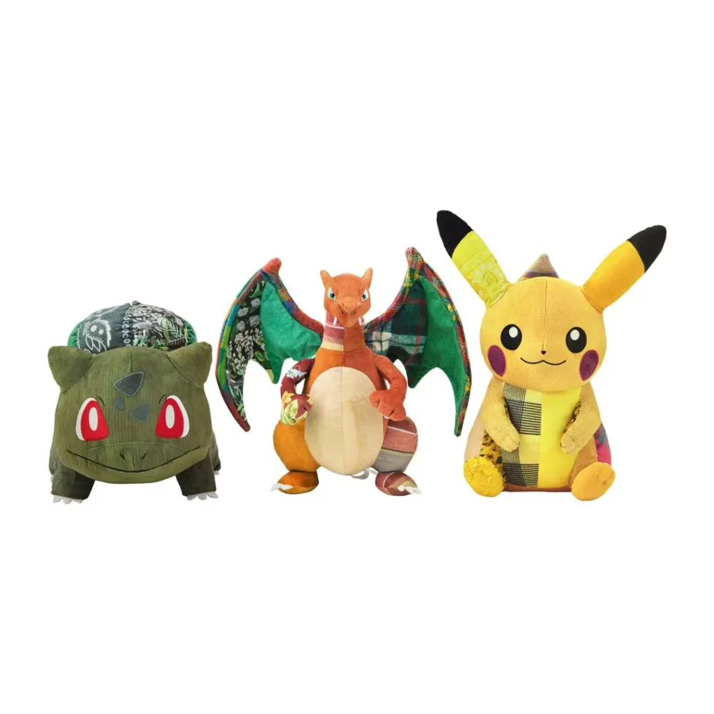 Sean Wotherspoon × Pokémon Center collection featuring three plush toys—Bulbasaur, Charizard, and Pikachu—shown together on a clean white background, each incorporating mixed vintage-style fabrics, corduroy, plaid, floral, and quilted textile detail