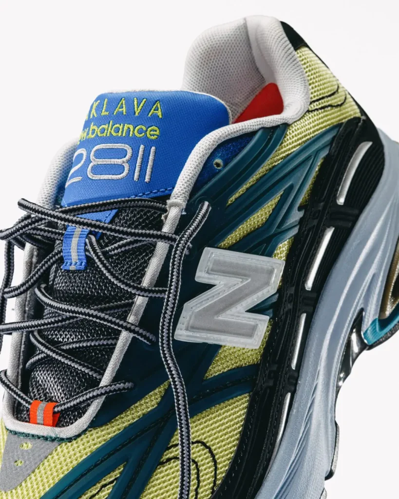 Close-up of the New Balance x Baklava 281 tongue and side panel, emphasizing embroidered Baklava branding, translucent N logo, rope laces, and layered teal overlay