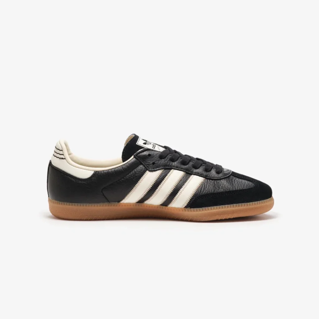 Opposite side profile of the black adidas Samba highlighting its streamlined silhouette and vintage gum outsole
