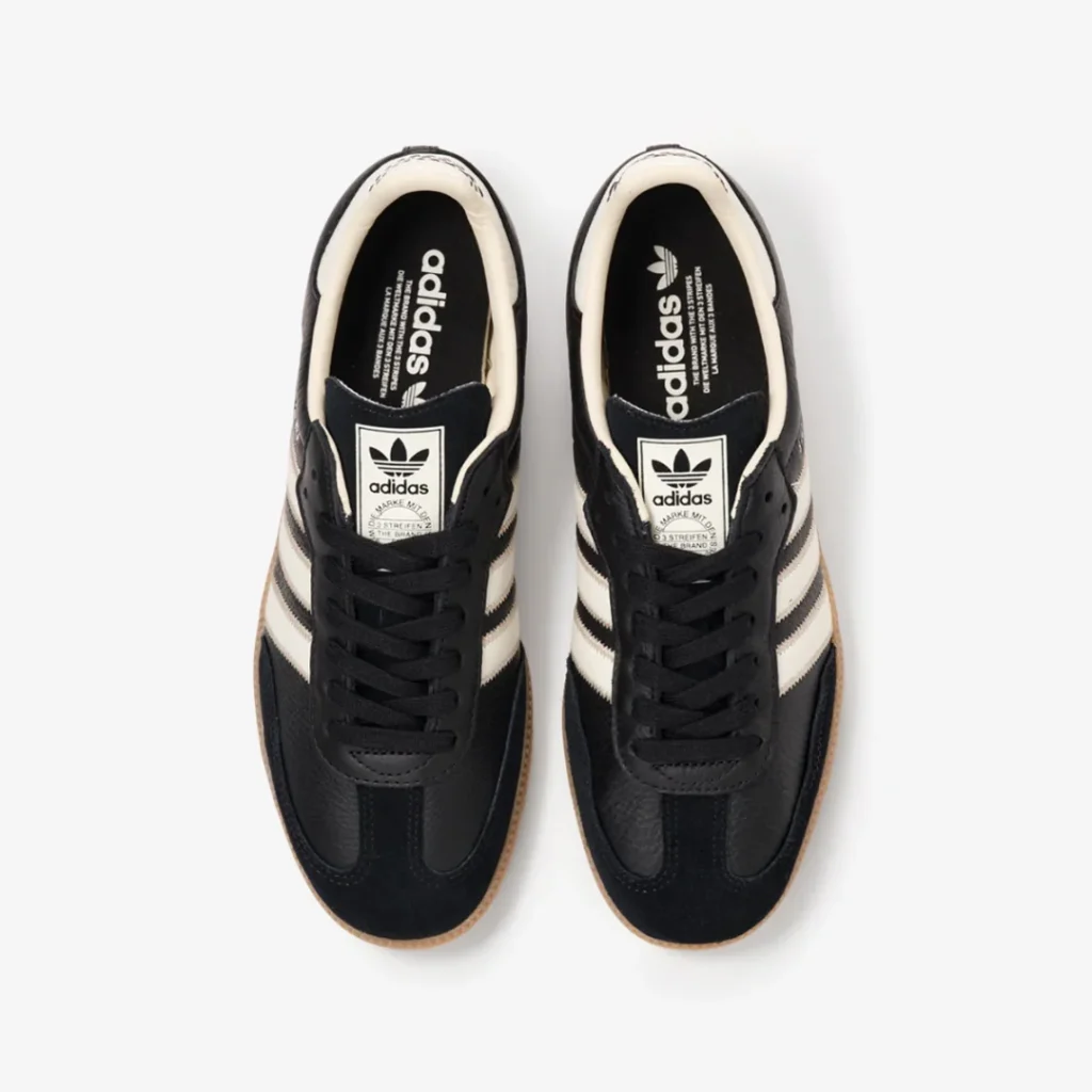Top-down view of the black adidas Samba featuring black laces, Trefoil tongue labels, and branded black insole