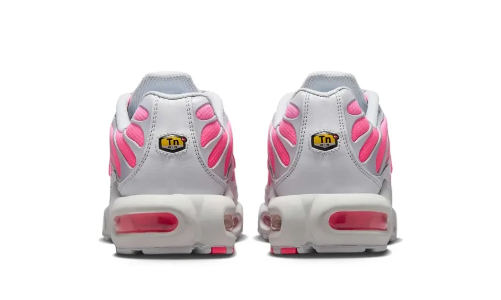 Heel view of the Air Max Plus pair display Tuned Air heel badges, view heel Air units, and layered heel construction
