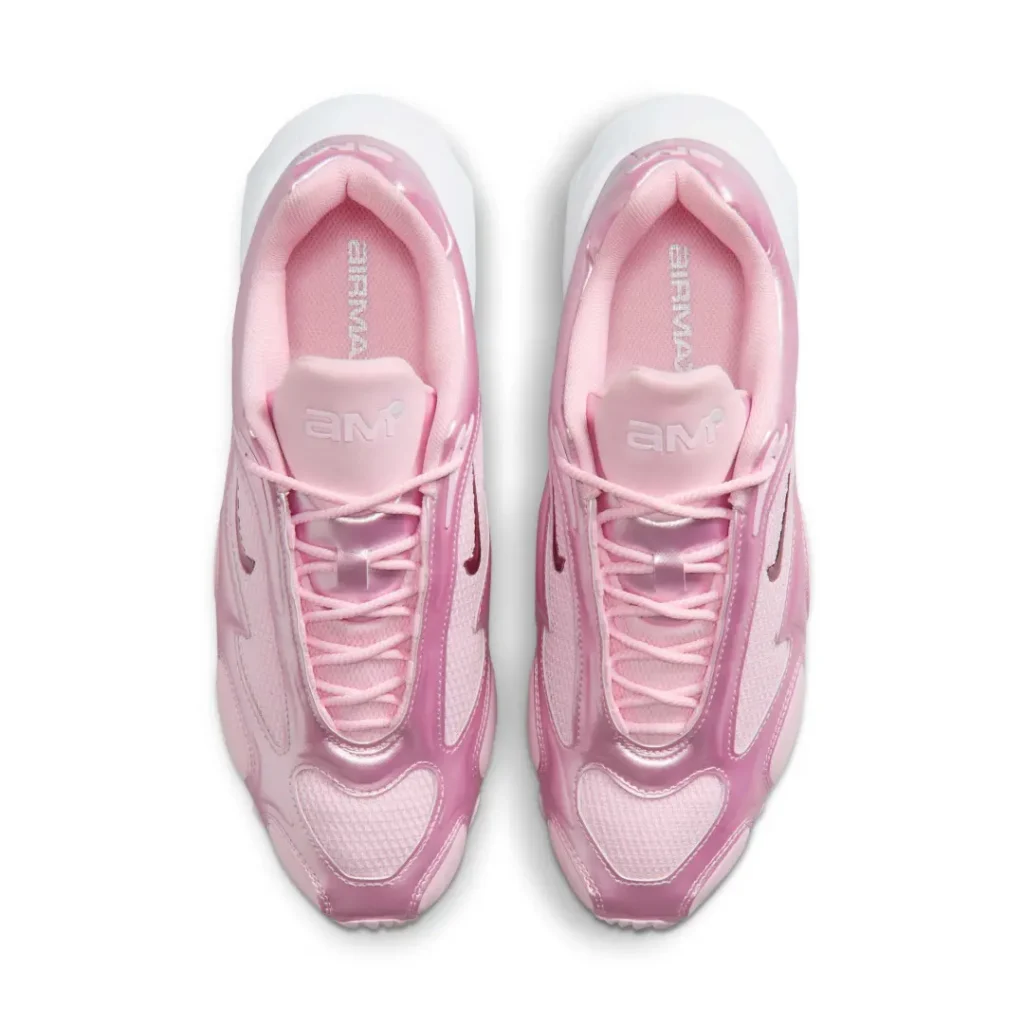 Angled three-quarter view of the metallic pink Nike Air Max Muse pair emphasizing its futuristic sil, sculpted overlays, and oversized white heel midsole