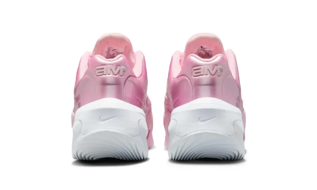 Rear view of the Nike Air Max Muse pair highlighting embossed AM branding, sculpted metallic heel panels, and the oversized white foam heel unit