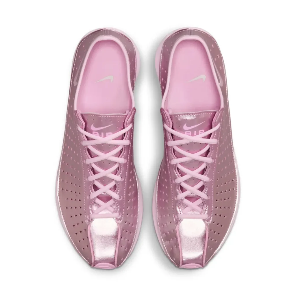 Top-down view of the metallic pink Nike Air shoe featuring tonal pink laces, padded collar, and Nike Air brand on the tongue