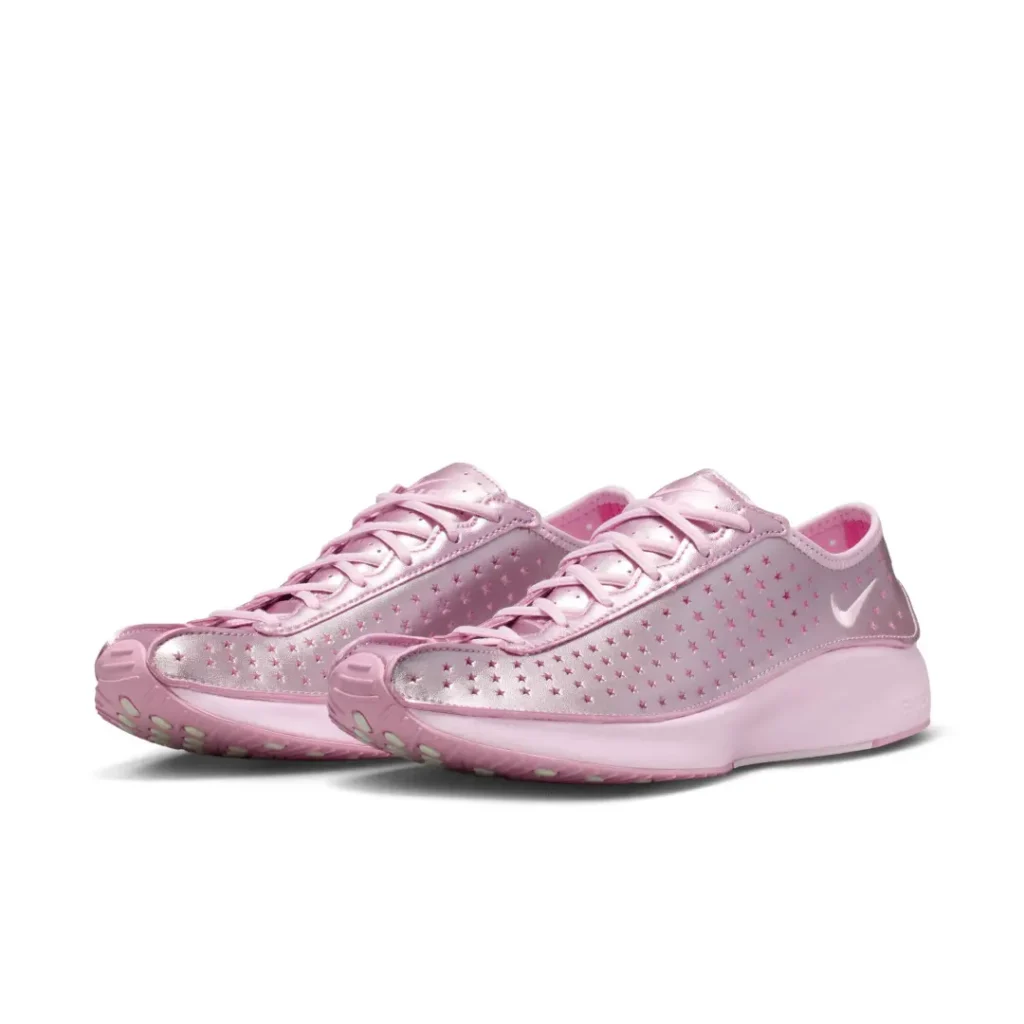 Three-quarter view of a pair of metallic pink Nike Air sneakers highlighting the star-perforated upper and sculpted pink midsole