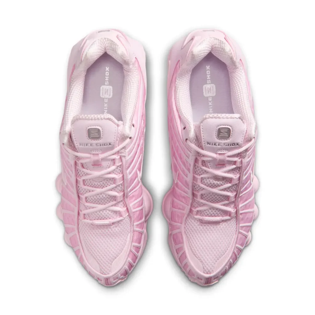 Overhead view of the pink Nike Shox TL pair showcasing padded collars, mesh toe boxes, tonal laces, and Nike Shox branding on the tongues and insole