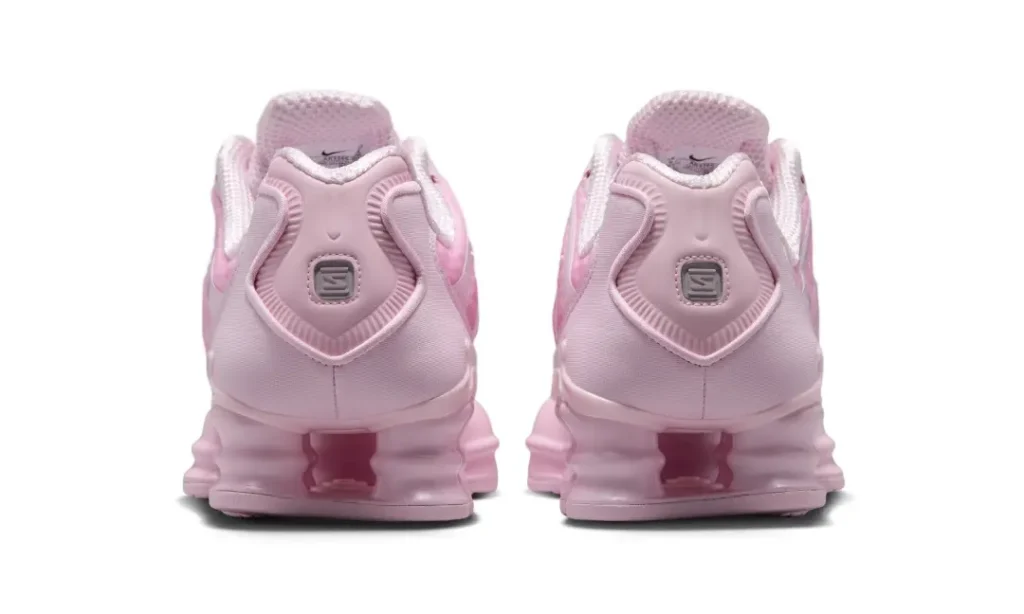 Heel view of the Nike Shox TL pair highlighting the molded heel counter, Shox columns, and centered Shox logo badge