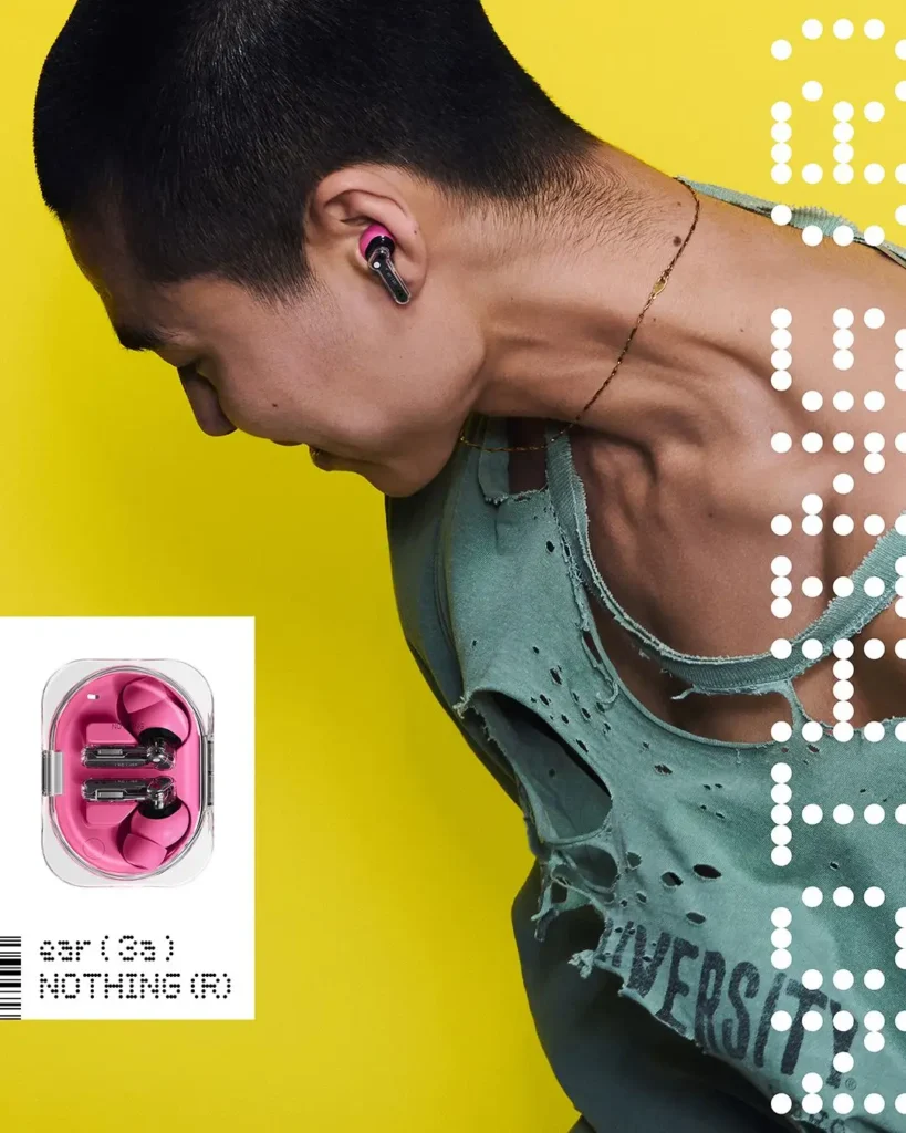 A model wearing a distressed mint-green sleeveless top poses against a bright yellow background while wearing the pink Nothing Ear (3a) earbud, with the matching charging case shown in an inset