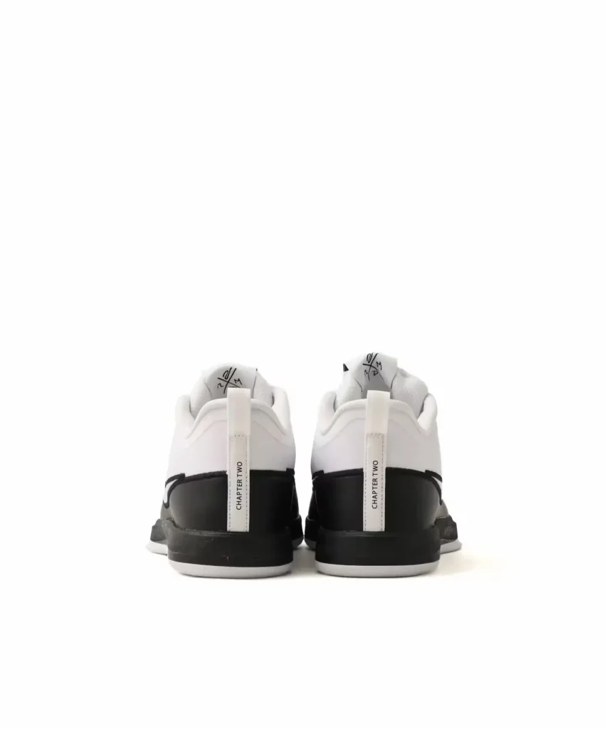 Rear view of the Nike BOOK Chapter Two shoe showing white heel pull tabs printed with "CHAPTER TWO" above black mid