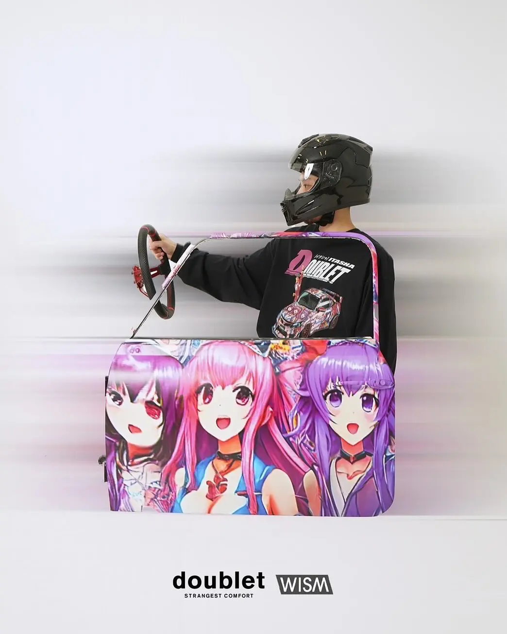 Model wearing a motorcycle helmet inside a wearable anime-themed car costume from the doublet x WISM collaboration.