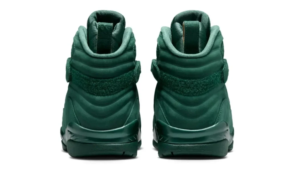 Rear view of the Air Jordan 8 x SoleFly shoe displaying quilted green ankle padding, heel pull tabs, textured heel wrap, and tonal mid