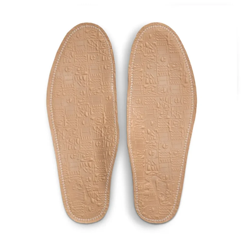 Pair of tan leather insoles for the Air Jordan 8 x SoleFly collaboration featuring embossed geometric artwork and subtle Nike brand