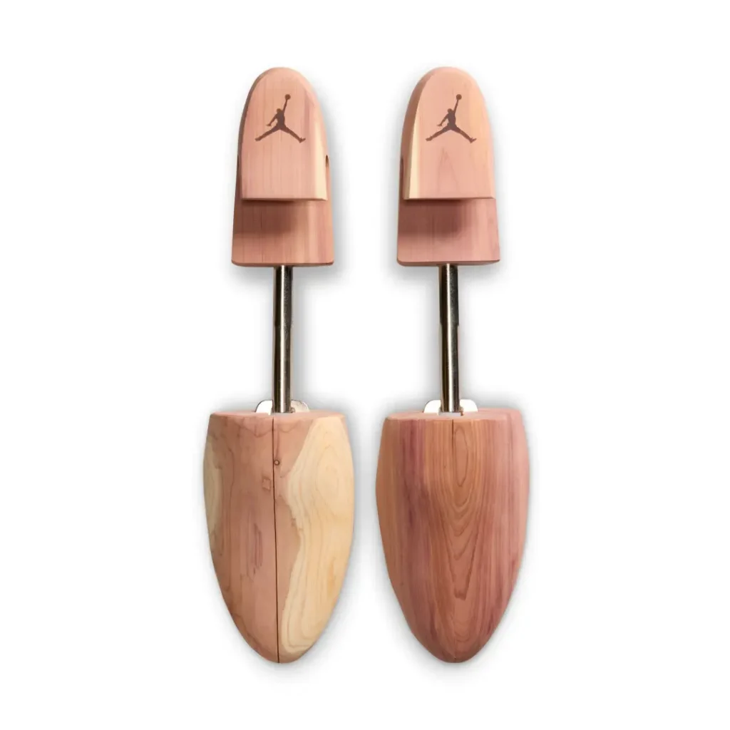 Pair of premium cedar wood Air Jordan shoe trees with engraved Jumpman logos and adjustable metal shaft