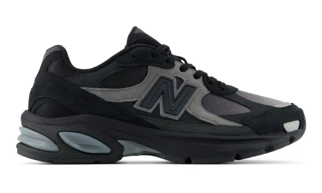 Lateral side profile of the New Balance U2010 "Black/Harbor Grey" emphasizing the layered upper, oversized N branding, and sculpted ABZORB midsole with Harbor Grey cushion pod
