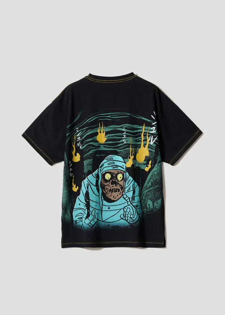 Black Tee featuring a large back print of a blue mummy emerging from a cave surrounded by glowing yellow ghost flame