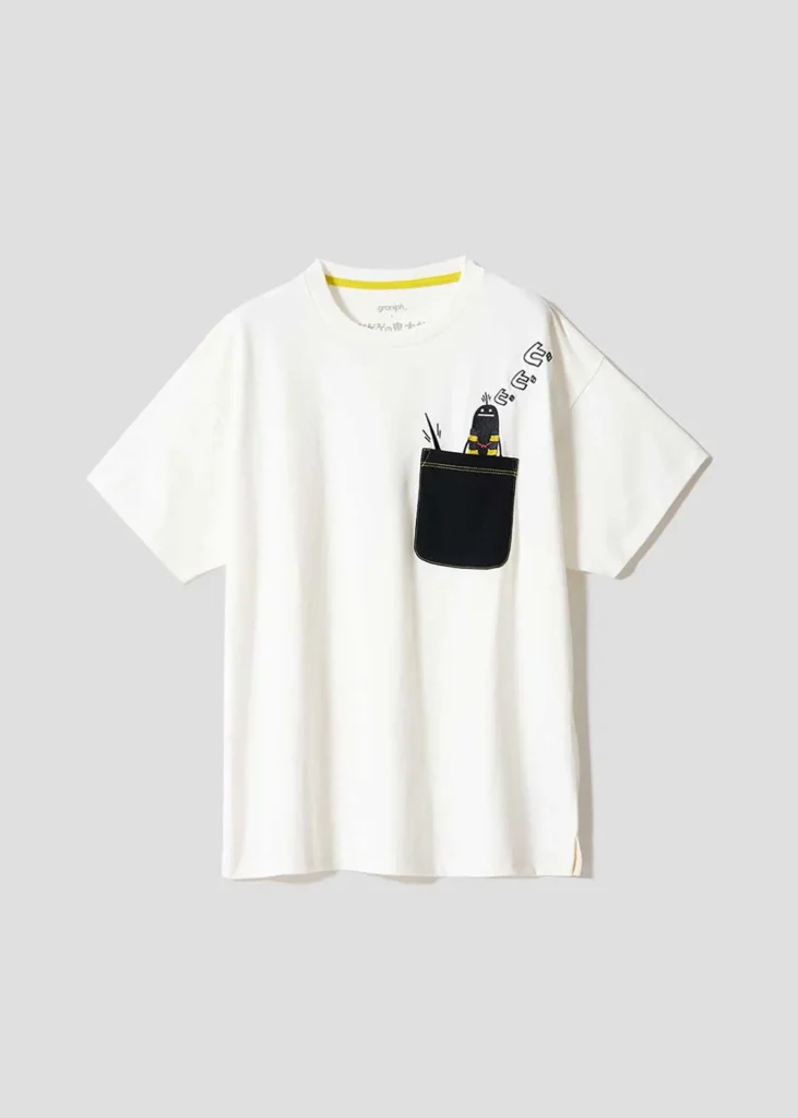 White Tee with a contrasting black chest pocket featuring a small mascot character peeking out with comic-style motion graphic