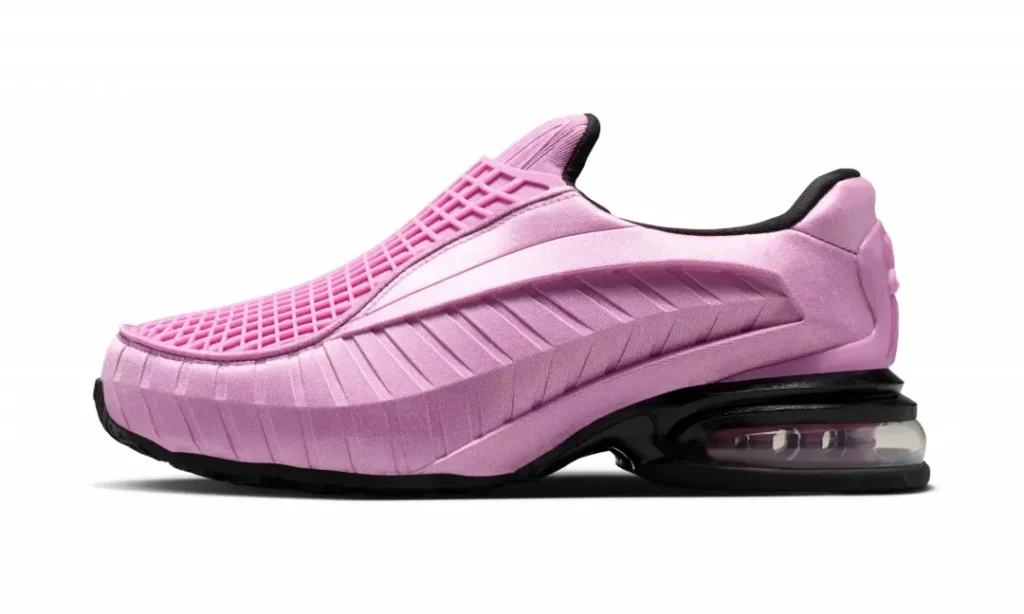 Lateral side profile of a pastel pink Nike slip-on shoe with flowing sculpted sidewalls, mesh-inspired cage over the vamp, black Air Max heel unit, and black rubber outsole