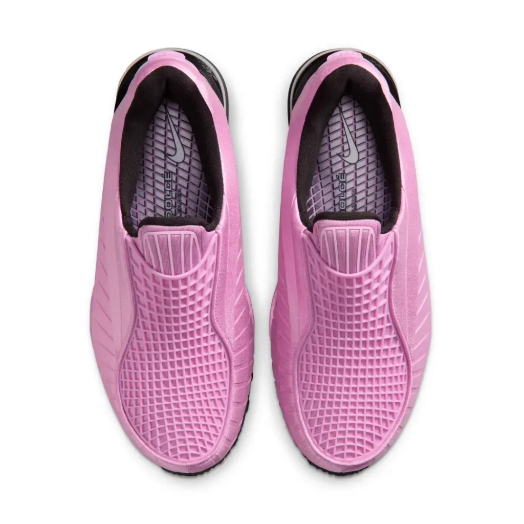 Top-down view of the pair showing the breathable pink lattice vamp, black inner lining, cushioned collar, and patterned insoles with Nike brand