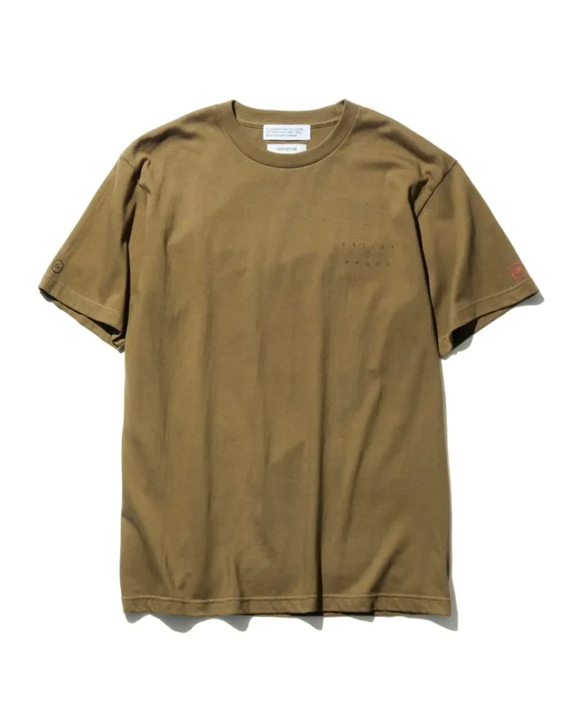 Front view of the olive green nonnative x Artist Proof T-shirt featuring a subtle chest logo and collide graphics on both sleeve