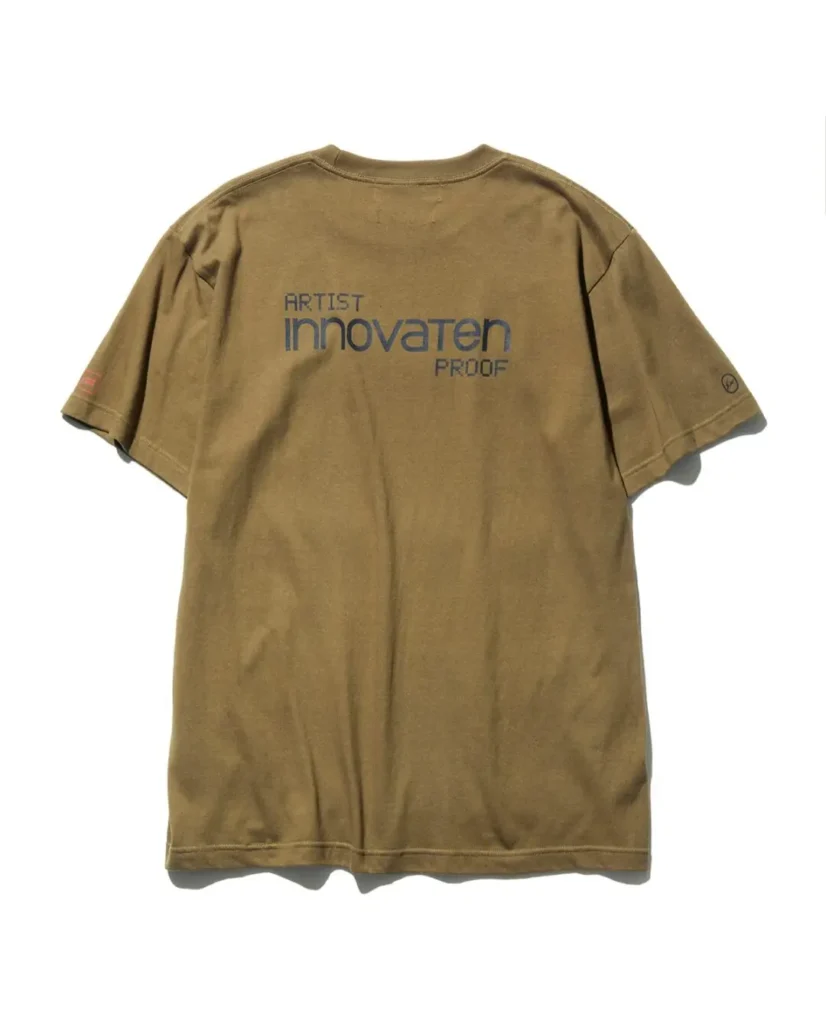 Rear view of the olive green Tee displaying the large navy "ARTIST innovaten PROOF" back graphic with sleeve logo