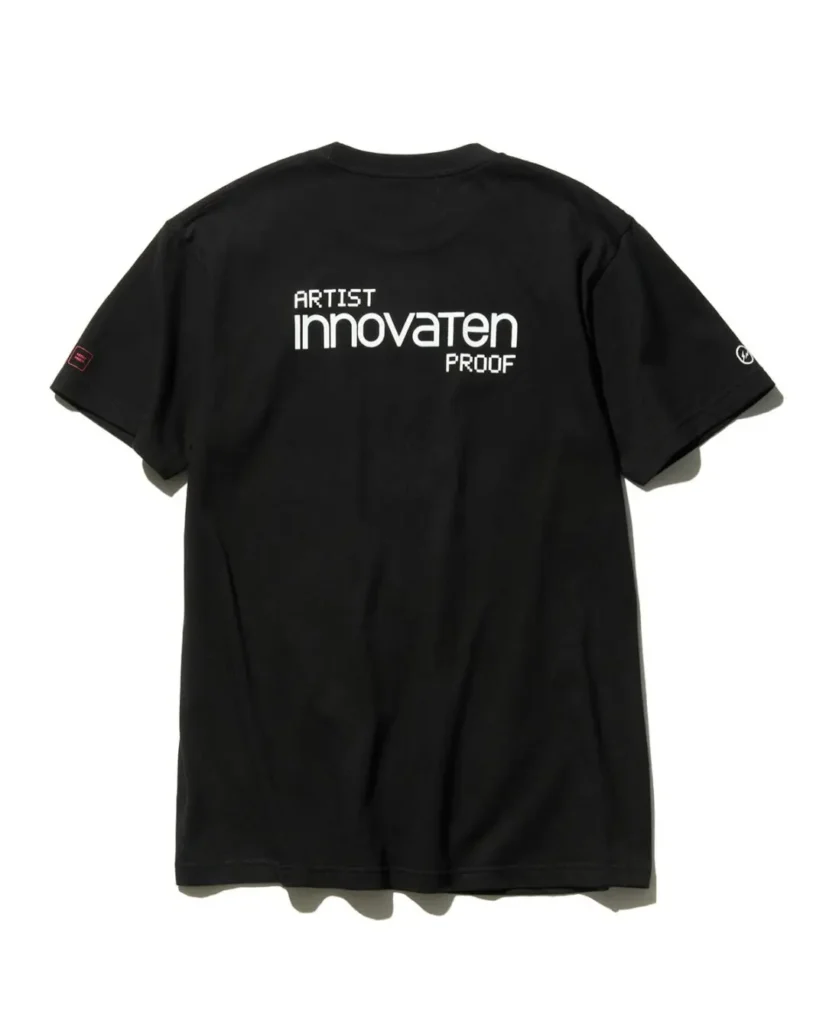 Back view of the black Tee featuring bold white "ARTIST innovaten PROOF" typography centered across the upper back