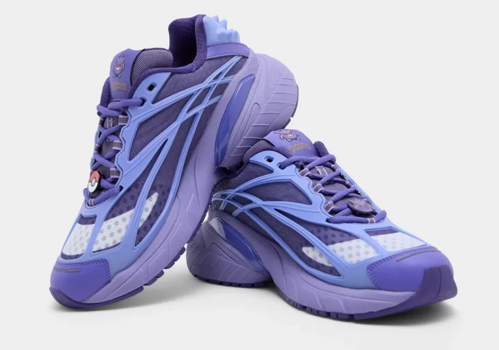Angled pair of Gengar-inspired adidas show shoe featuring layered purple overlays, breathable mesh panels, oversized cushioned midsoles, Pokémon tongue brand, and themed lace accessor