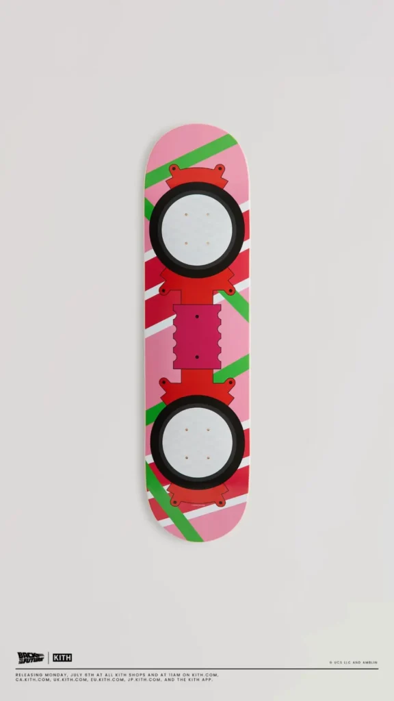 Pink skateboard deck inspired by the Back to the Future hoverboard featuring colorful geometric graphics in pink, green, red, and white