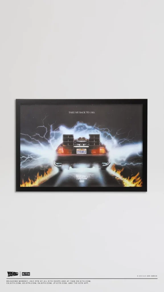 Framed Back to the Future artwork featuring the rear view of the DeLorean surrounded by lightning and flaming tire tracks with the phrase "Take Me Back to 1985."