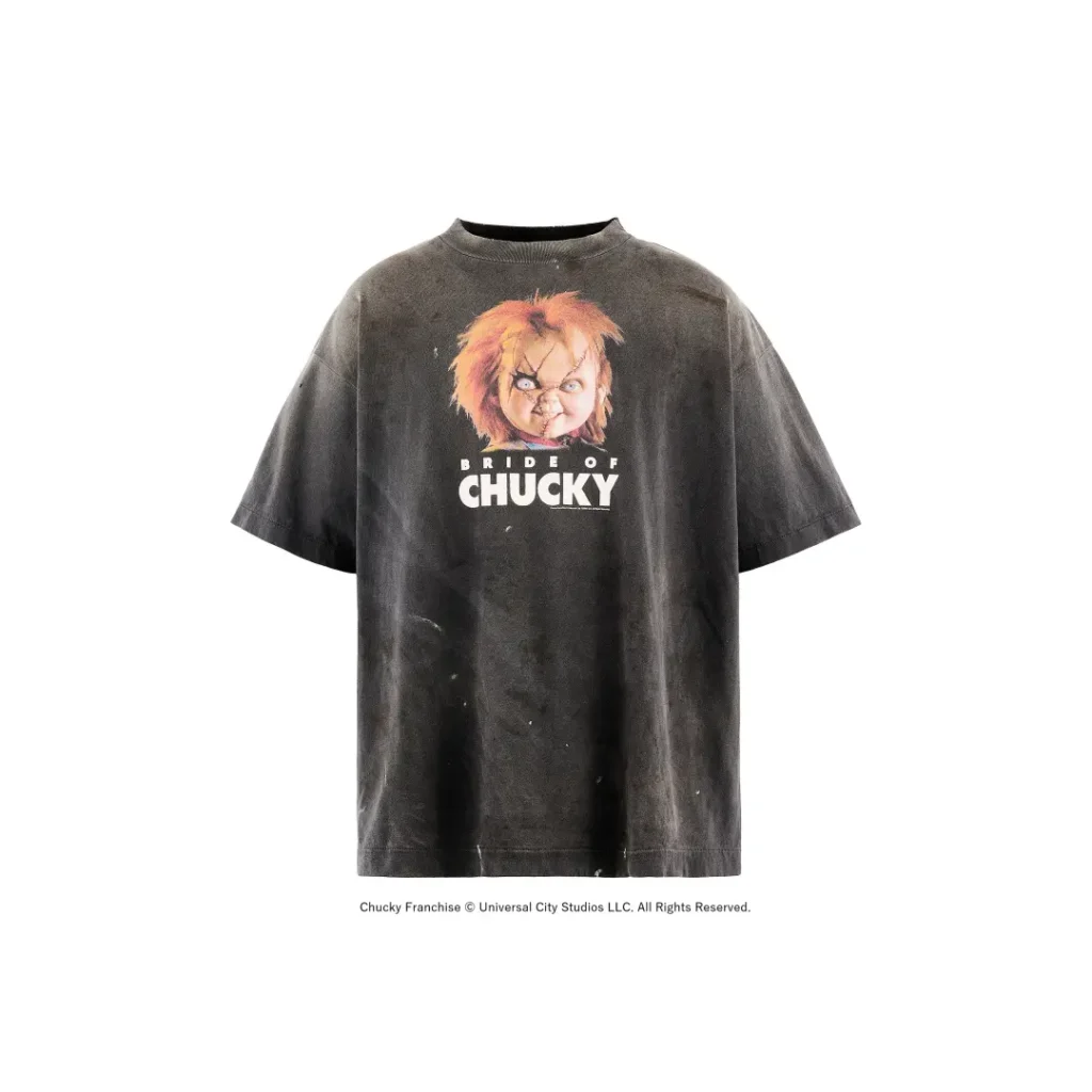 Front product shot of a faded black oversized "Bride of Chucky" Tee on a clean white background, highlighting the distressed wash and centered movie show
