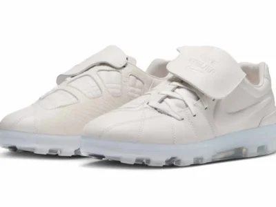 Pair of white Nike Atelier low top shoe with oversized fold over tongue flaps and translucent Air cushioned sole