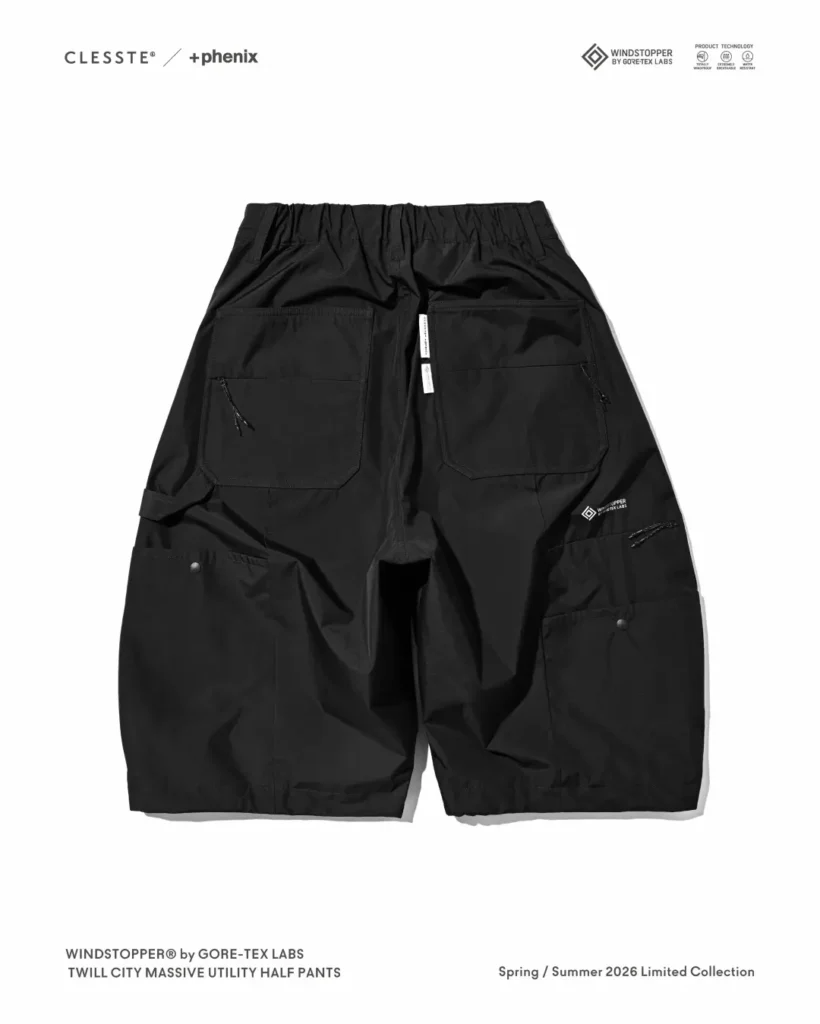 Rear pocket close-up featuring oversized patch pocket, zipper detail, and WINDSTOPPER by GORE-TEX LABS logo printed on the black utility short