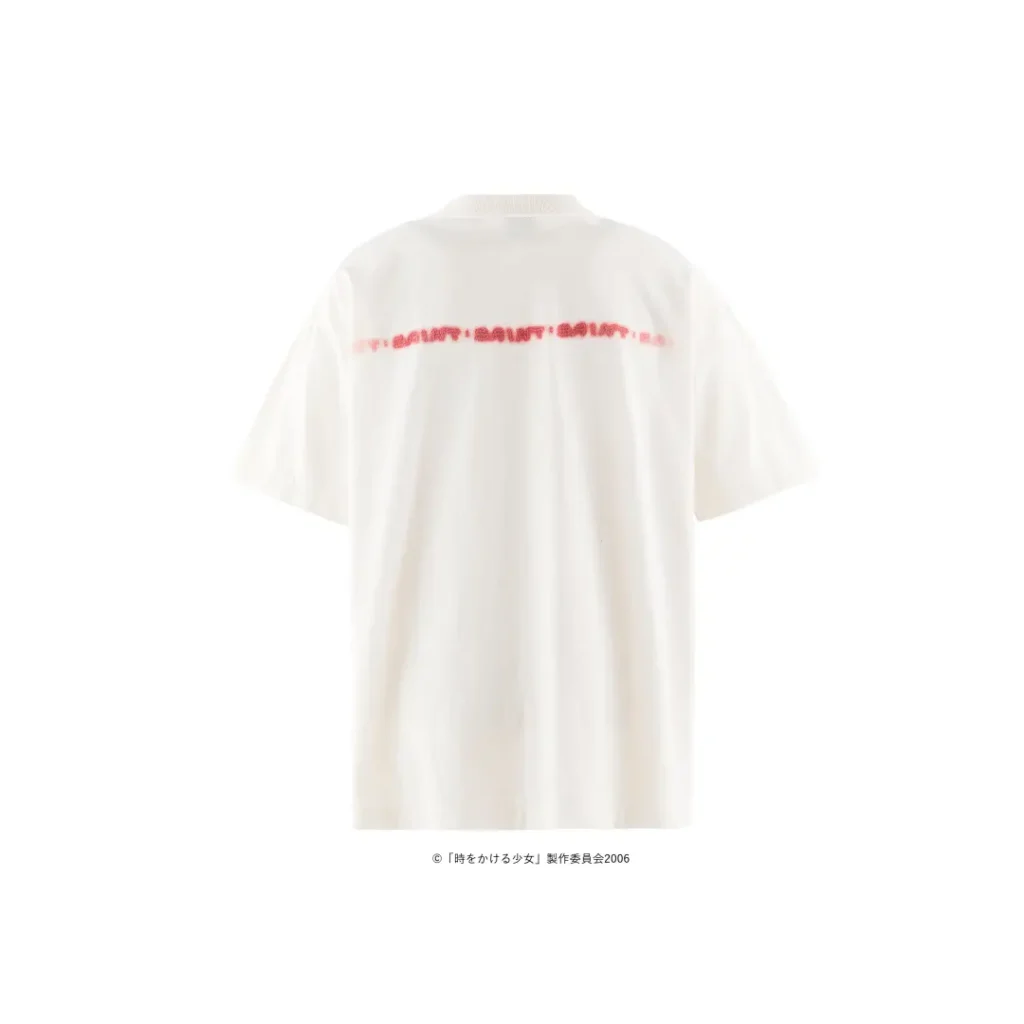 Back product image of an oversized white T-shirt featuring a minimalist design with a blurred red text graphic printed horizontally across the upper back