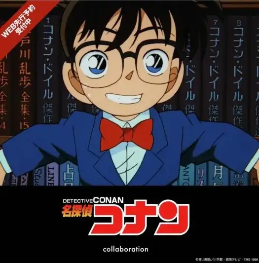 Promotional artwork for the Detective Conan x Graniph collaboration featuring Conan Edogawa smiling in front of a bookshelf with the Detective Conan logo displayed below and a banner highlighting web preorder availability.