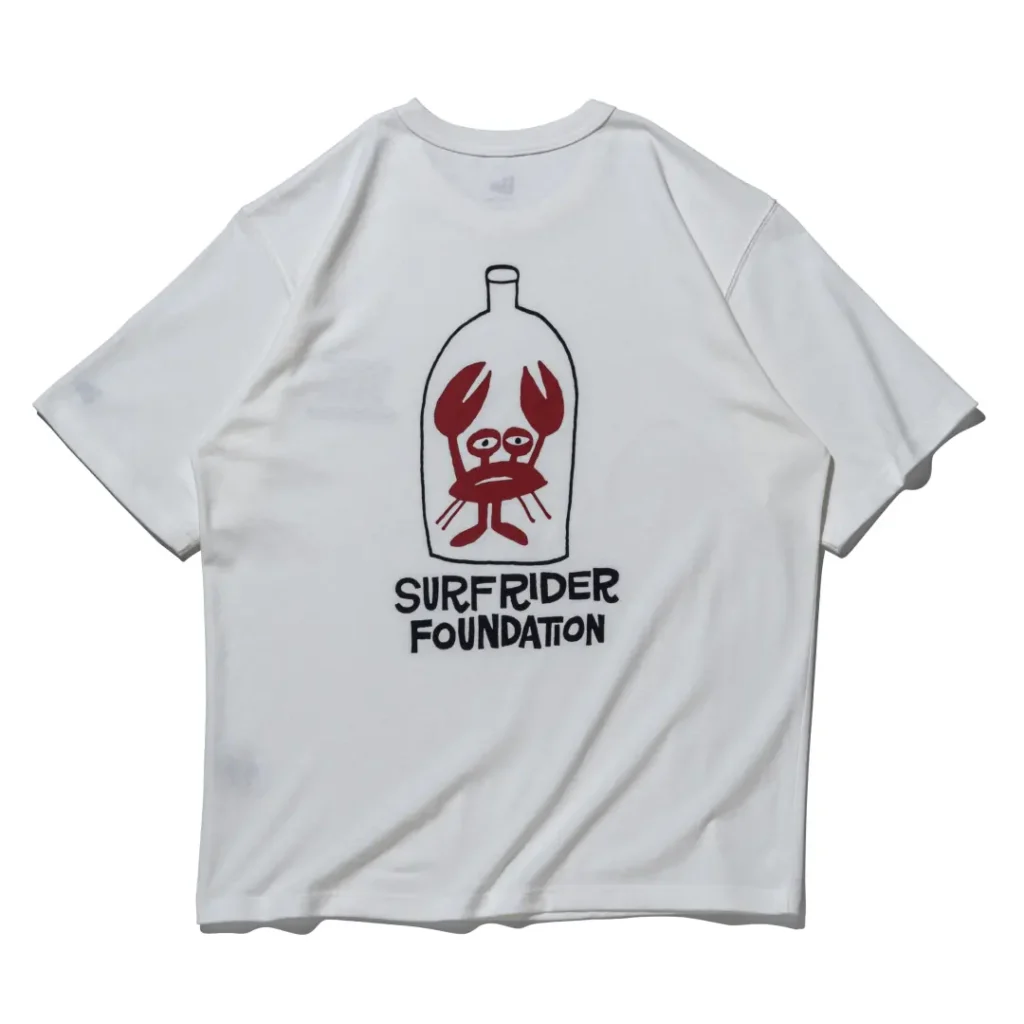 White Tee back featuring a large bottle graphic with a red crab illustration above bold black Surf Rider Foundation brand