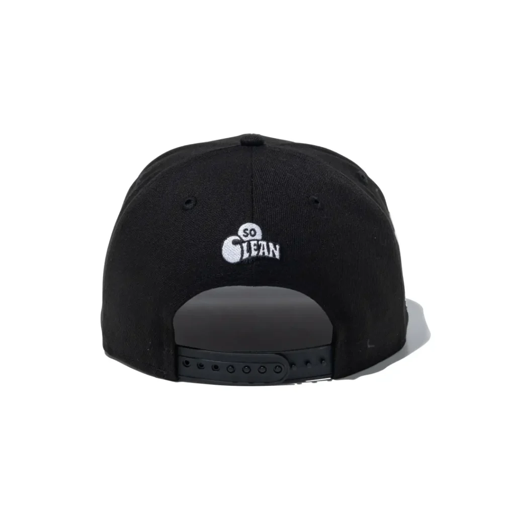 Rear view of a black snapback cap featuring a white "SO CLEAN" embroidered logo above the adjustable plastic closure