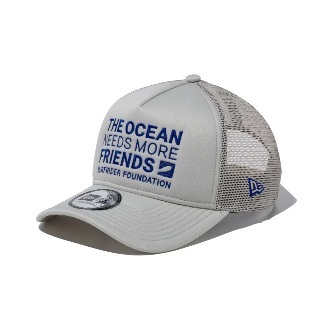 White mesh trucker cap with blue "The Ocean Needs More Friends" Surf Rider Foundation embroidery and matching blue New Era side logo