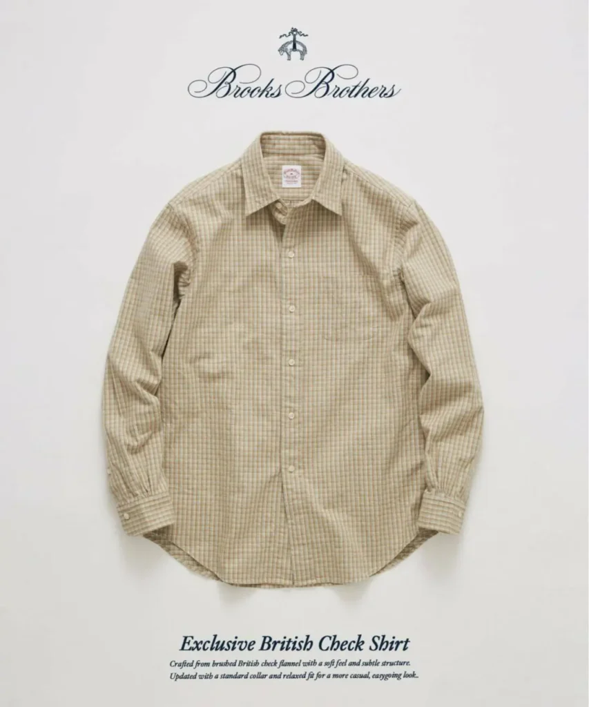 Front-facing product image of a Brooks Brothers Exclusive British Check Shirt in a soft beige and tan plaid. The brushed flannel fabric, relaxed fit, standard collar, chest pocket, white button fastening, and curved hem create a casual interpretation of the brand's traditional shirt