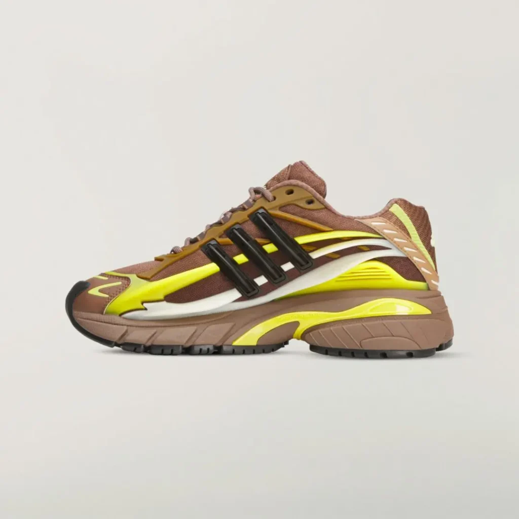 Opposite side profile of the adidas x Ne.jelly Virginia shoe showcasing brown textile construction, fluorescent yellow accents, black support cage, and a show-inspired sculpted mid