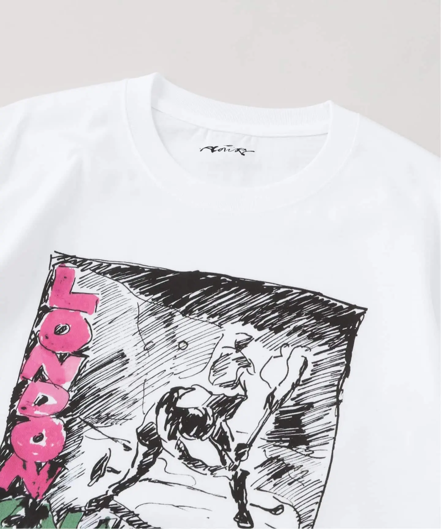 Detail shot of the T-shirt: Ray Lowry's ink illustration of the Palladium moment printed beneath pink London Calling style lettering, with Lowry's signature stitched at the collar