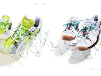Two ASICS x Lttt table tennis shoes displayed on a white studio background, showcasing the collection's white and lime green colorways with translucent overlays, ornate black graphics, dual-lace systems, and sculptural wire stands alongside branded table tennis balls