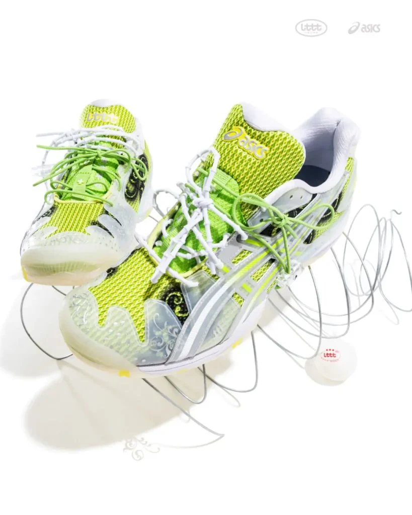Studio product image of the lime green ASICS x Lttt table tennis shoe highlighting breathable mesh construction, translucent structural overlays, black ornamental side graphics, and layered white and green lace