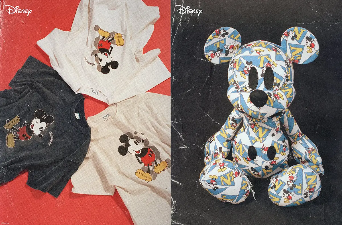 Promotional collage showcasing a Disney collaboration featuring three Mickey Mouse graphic T-shirts in white and washed black displayed on a red background alongside a collectible Mickey Mouse plush covered in an all-over blue monogram-inspired print with repeating Mickey illustrations.