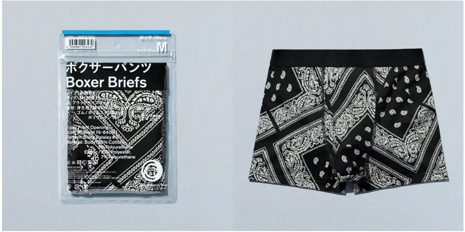 FamilyMart boxer briefs shown in retail packaging alongside the unpackaged garment. The black boxer briefs feature an all over white bandana paisley print with a solid black elastic waistband, highlighting the convenience store retailer's casual apparel offering.