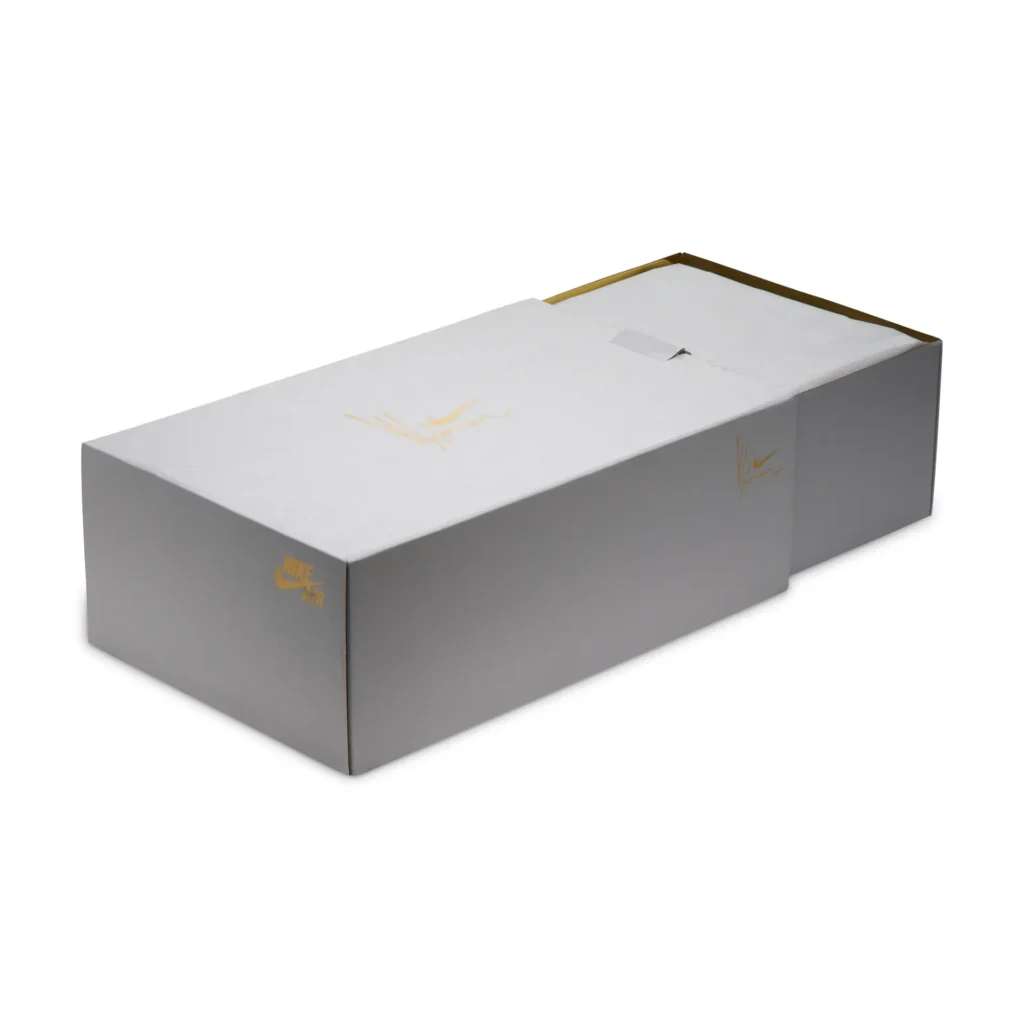 Premium Nike Air Force 1 presentation box in matte gray with subtle gold Nike Air branding and Yoon signature graphics, shown in a clean studio product photograph