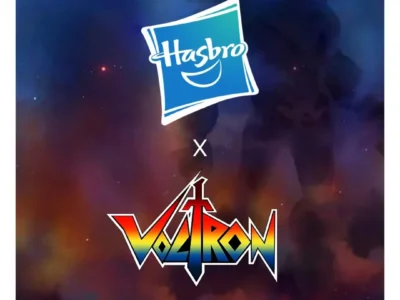 Promotional graphic announcing a collaboration between Hasbro and Voltron. The Hasbro logo appears above the colorful retro-style Voltron logo with an "X" between them, indicating the partnership. Bold white text at the top reads "ANNOUNCING," while the bottom states "ACTION FIGURES. TOYS. ROLEPLAY." A dark, space-themed background features the faint silhouette of the Voltron robot standing behind the logos with blue and orange nebula-like light